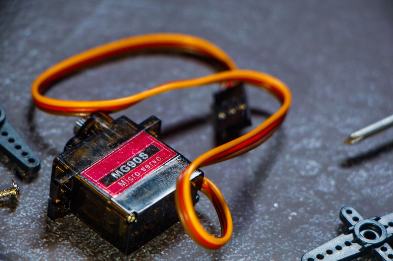About Detailed view of MG90S micro servo motor, perfect for robotics projects.