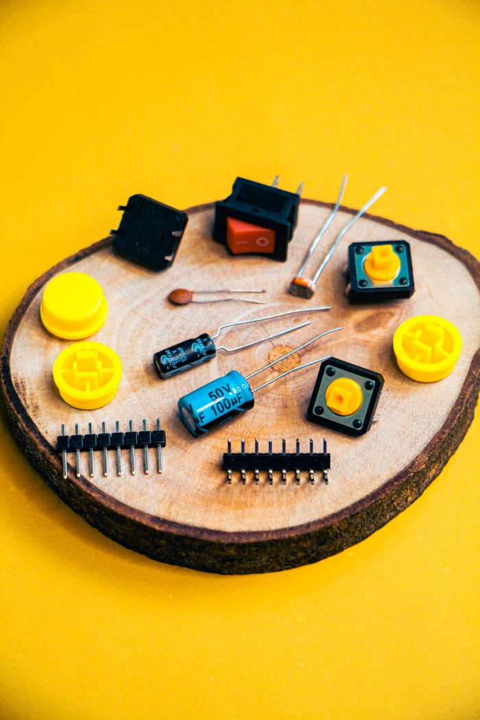 Services Assorted electronic components on a wooden base. Perfect for robotics and electronics projects.